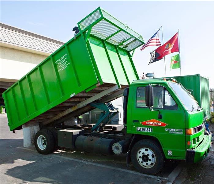 SERVPRO dump truck in office parking lot.