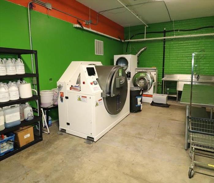 Green contents cleaning room with Esporta machine.
