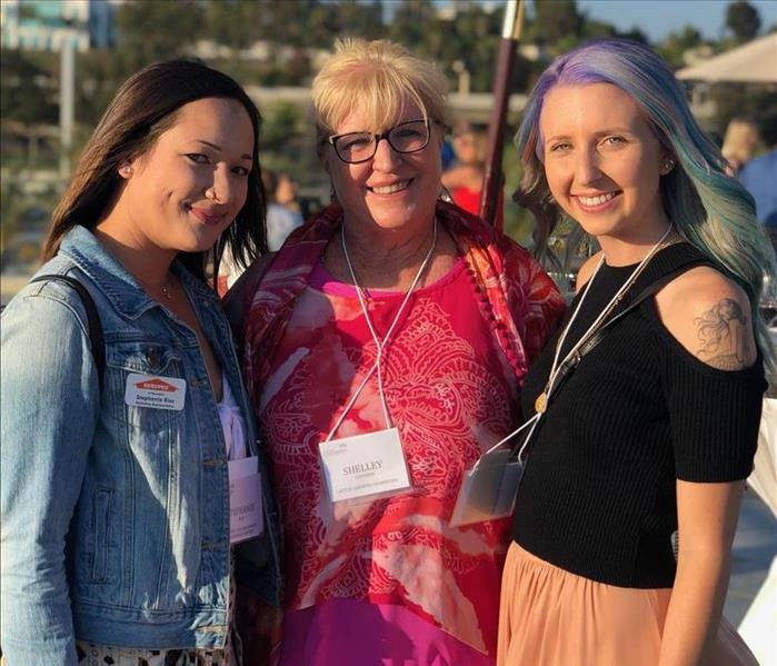 Three women at an event.