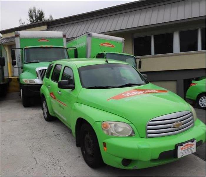 SERVPRO vehicles parked in lot.